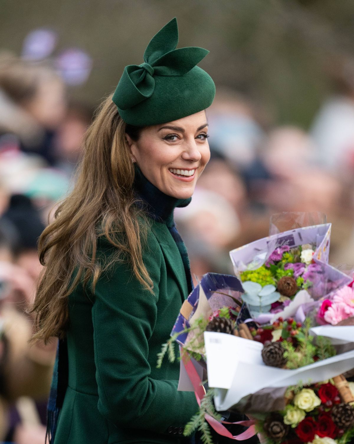 Kate laden with flowers and gifts last Christmas