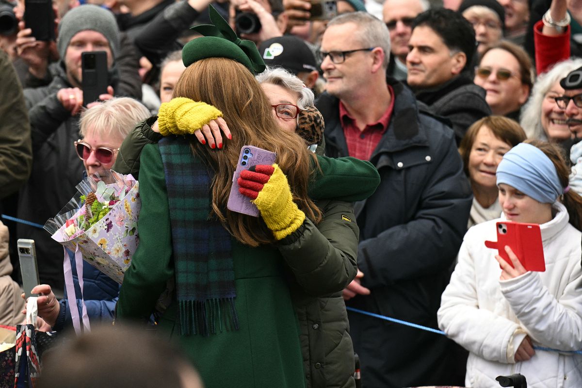 Princess of Wales is hugged by a wellwisher 