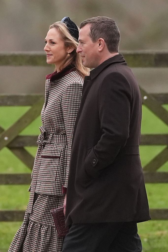 Harriet Sperling (left) and Peter Phillips side on in coats