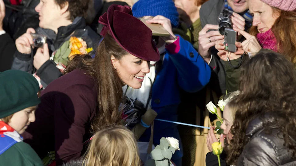 Catherine, Princess of Wales talks to fans as she walks to church on Christmas Day 2011