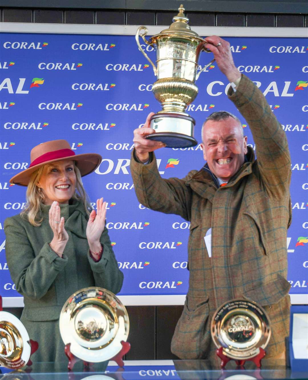 Sophie, the Duchess of Edinburgh, presenting the trophy to Bryan Drew, the winning owner of the Coral Gold Cup