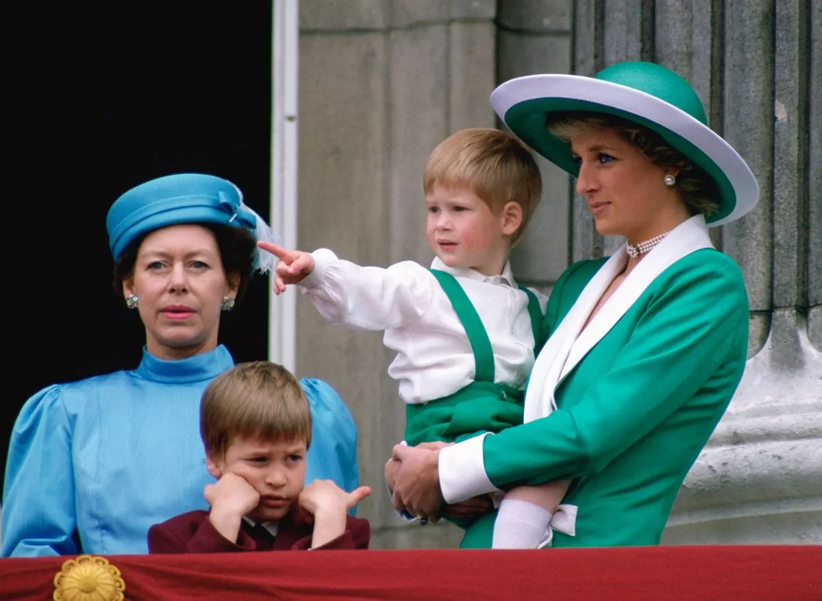Princess Diana holding young Prince Harry with Prince William and Princess Margaret