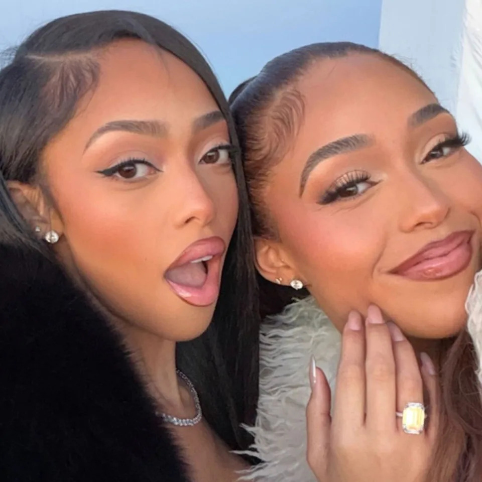 "Marry Christmas," the duo captioned their post, which included snaps of the basketball icon getting down on one knee for a shocked Woods. <span class="image-credit">(Instagram)</span>