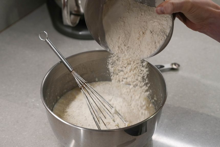 In a large bowl, stir together a blend of activated yeast, flour, warm milk, eggs, baking soda and butter.