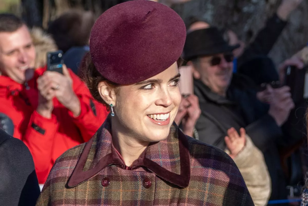 Princess Eugenie grins to crowds outside the church