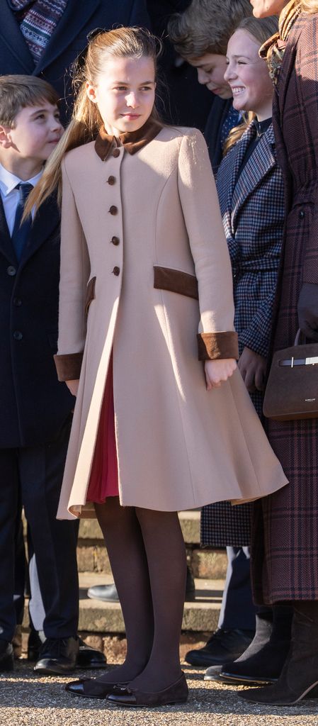 Princess Charlotte with siblings outside church in tan coat dress