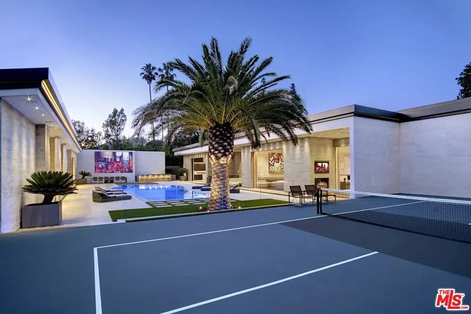 Tennis court by the pool at Kylie Jenner's California home in Holmby Hills
