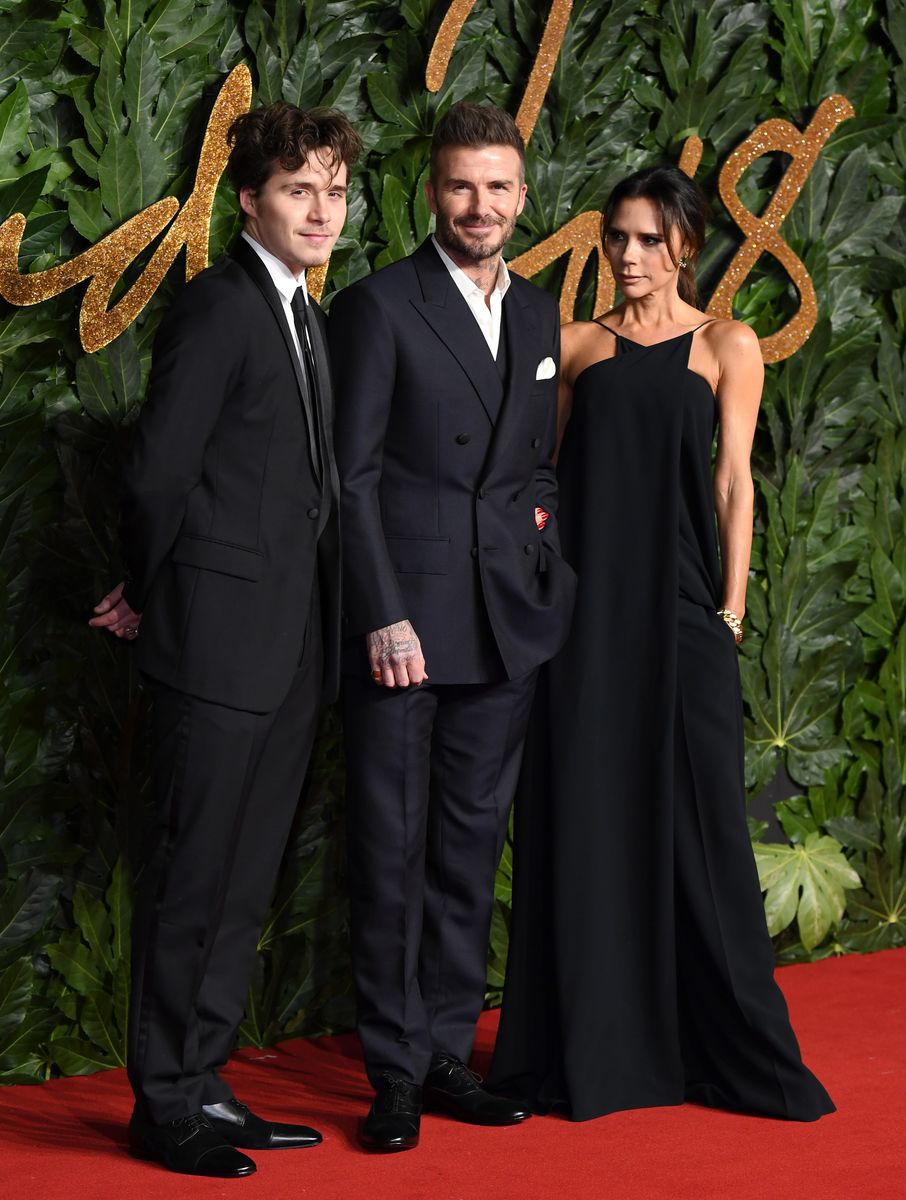  Brooklyn Beckham, David Beckham and Victoria Beckham arrive at The Fashion Awards 2018 In Partnership With Swarovski at Royal Albert Hall on December 10, 2018 in London, England.  (Photo by Karwai Tang/WireImage)
