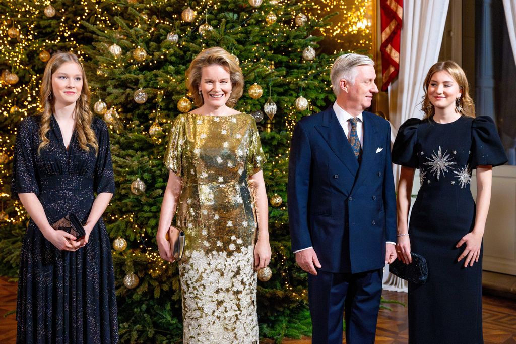 Princess Eleanore, Queen Mathilde, King Philippe and Princess Elisabeth in front of a Christmas tree