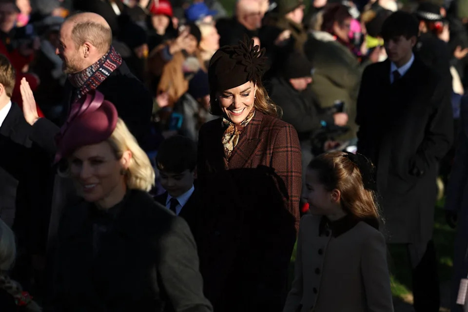 Catherine, Princess of Wales (C), holds hands with Prince Louis (L) and Princess Charlotte (AFP via Getty Images)