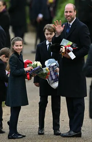OLI SCARFF/AFP via Getty From left: Prince Louis, Princess Charlotte, Prince George and Prince William hold gifts after Christmas Day service at St. Mary Magdalene Church on Dec. 25, 2024.
