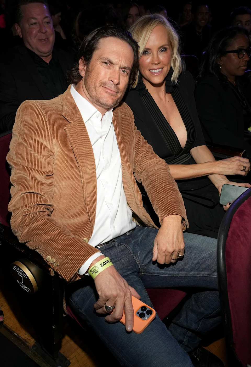 Oliver and Erinn Hudson seated at an event