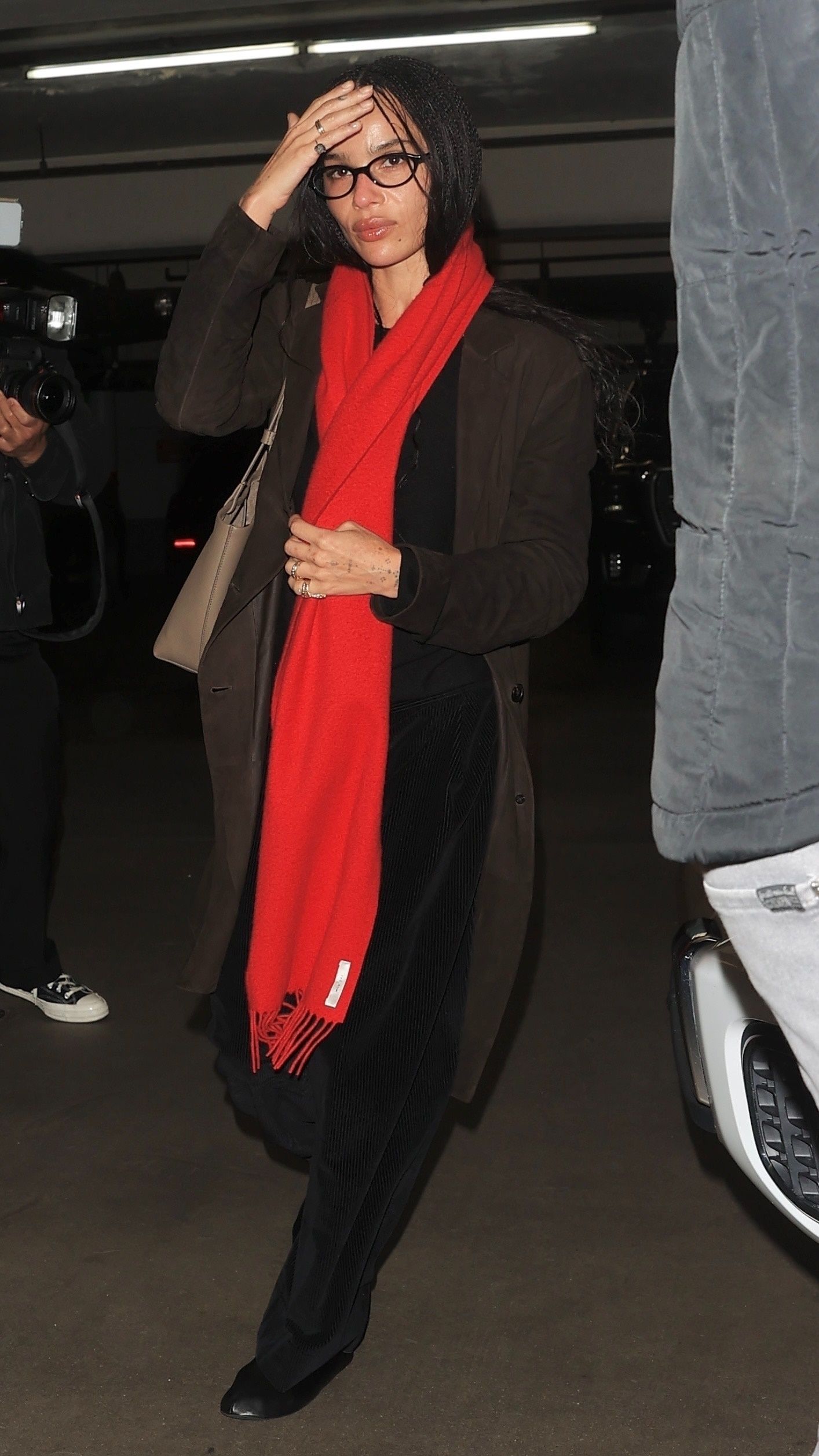 Image may contain Zoë Kravitz Clothing Scarf Coat Adult and Person