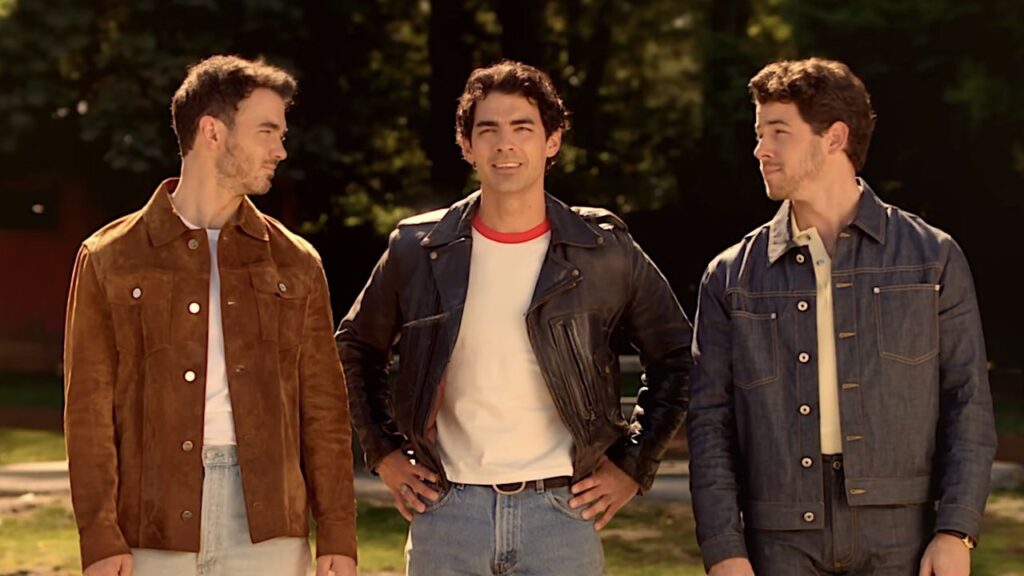 Someone Asked If The Jonas Brothers Are Doing Camp Rock 3 Due To ‘Debt,’ And Joe Jonas Didn’t Hold Back The Jonas Brothers staring out at the lake in the Camp Rock 3 teaser trailer