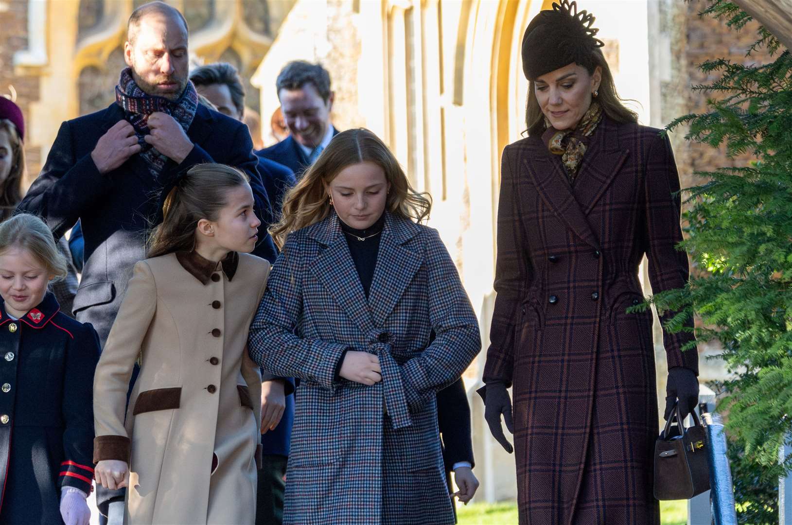 PIC BY GEOFF ROBINSON PHOTOGRAPHY 07976 880732. Picture dated December 25th shows the Royal Family attending Christmas morning service at St Mary Magdalene church in Sandringham. Picture shows Prince William, Prince of Wales, Catherine, Princess of Wales Princess Charlotte and Lena (left) and Mia Tindall.