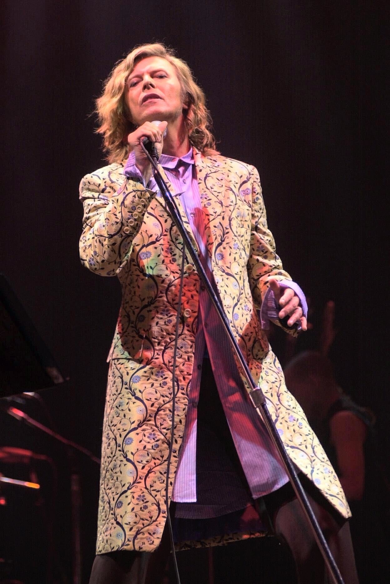 David Bowie donned a remarkable outfit of Alexander McQueen frock coat and Oxford bags