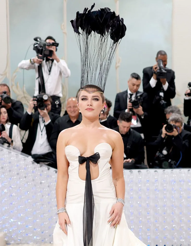 Florence Pugh attends The 2023 Met Gala with a buzz cut