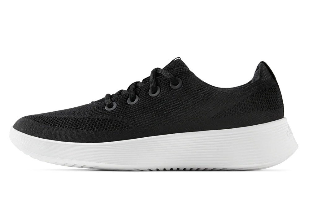 Black knit shoe with white sole.