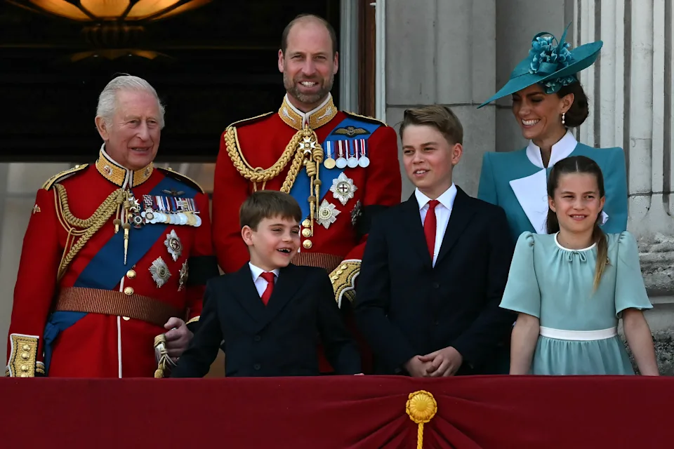 TOPSHOT - (L to R) Britain's King Charles III, Britain's Prince William, Prince of Wales, Britain's Prince Louis of Wales, Britain's Prince George of Wales, Britain's Catherine, Princess of Wales and Britain's Princess Charlotte of Wales, smile whilst standing on the balcony of Buckingham Palace after attending the King's Birthday Parade "Trooping the Colour" in London on June 14, 2025. The ceremony of Trooping the Colour is believed to have first been performed during the reign of King Charles II. Since 1748, the Trooping of the Colour has marked the official birthday of the British Sovereign. Over 1500 parading soldiers and almost 300 horses take part in the event. (Photo by Ben STANSALL / AFP) (Photo by BEN STANSALL/AFP via Getty Images)