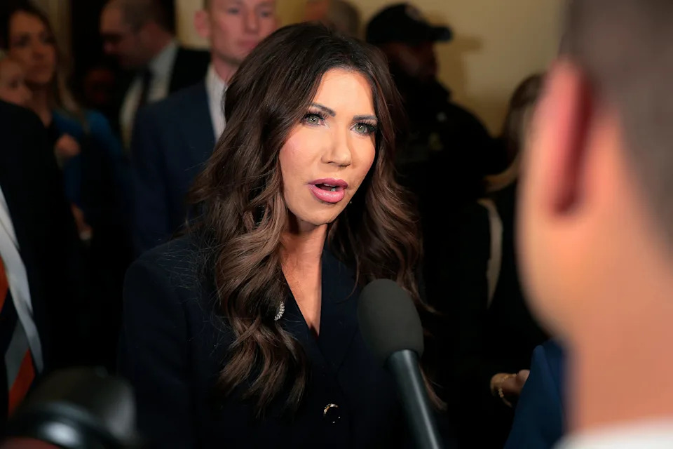 Homeland Security Secretary Kristi Noem speaks to members of the media as she arrives to testify before the House Homeland Security Committee on December 11, 2025. / Heather Diehl/Getty Images