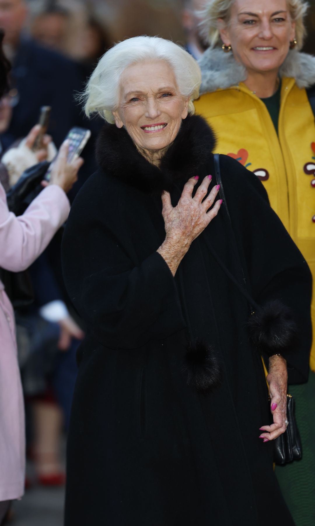 Mary Berry wrapped up in a black furry coat