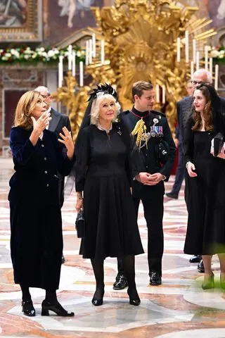 Pool/Getty Queen Camilla and Major Ollie Plunket during a visit to the Pauline Chapel at Vatican City, Vatican on Oct. 23, 2025.