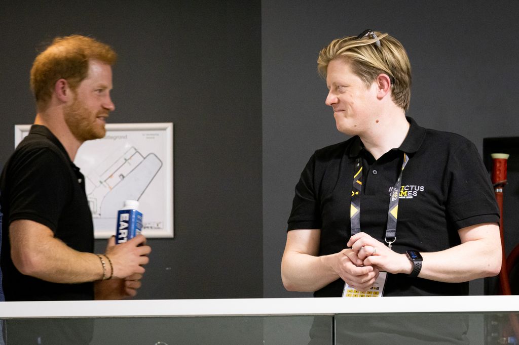Prince Harry, Duke of Sussex and James Holt facing eachother