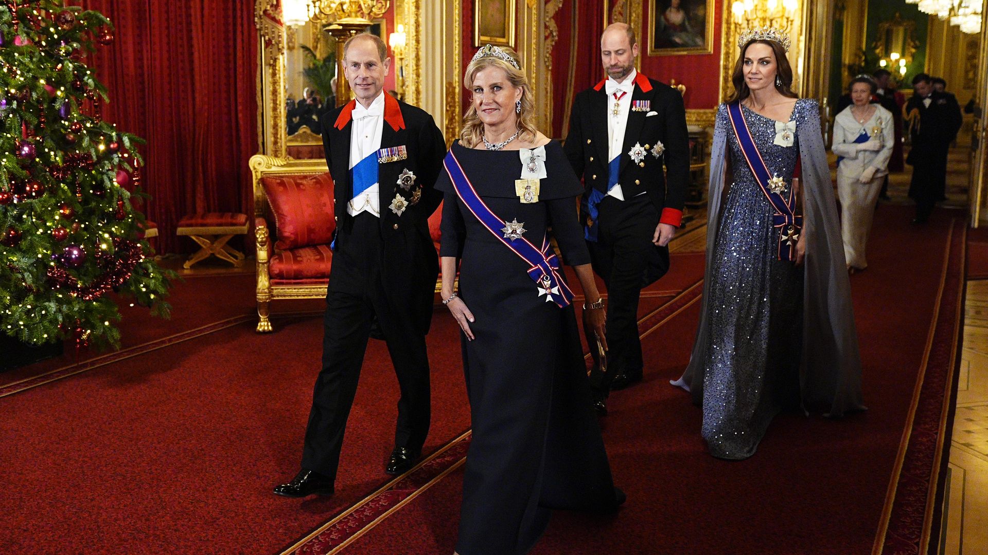 Duke and Duchess of Edinburgh walking in front of Prince and Princess of Wales