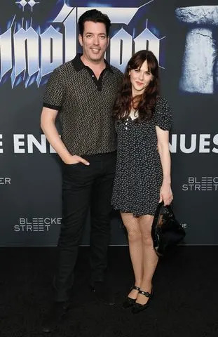 Monica Schipper/Getty Jonathan Scott and Zooey Deschanel on Sept. 9.