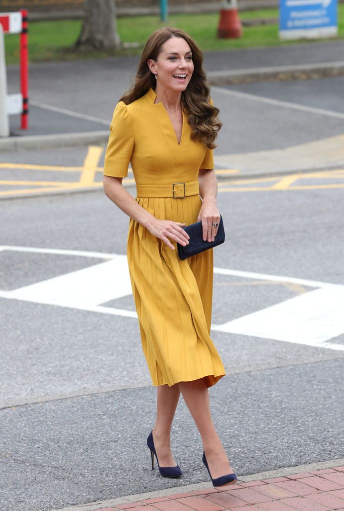 Kate Middleton walking in yellow dress