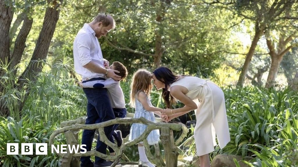 Harry and Meghan embrace children Archie and Lilibet in Christmas photo Harry and Meghan embrace children Archie and Lilibet in Christmas photo