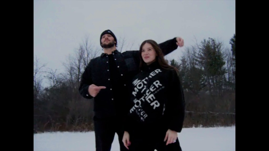Hailee Steinfeld wearing a "Mother" sweatshirt while showing off her baby bump with husband Josh Allen.