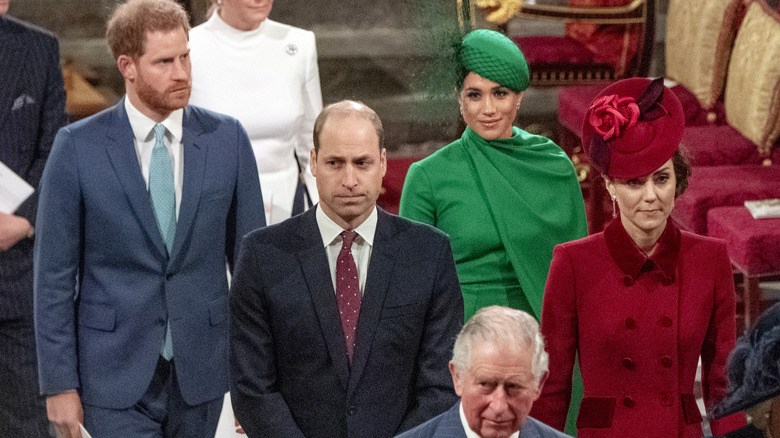Prince Harry, Prince William, Meghan Markle, Kate Middleton, and King Charles III walking