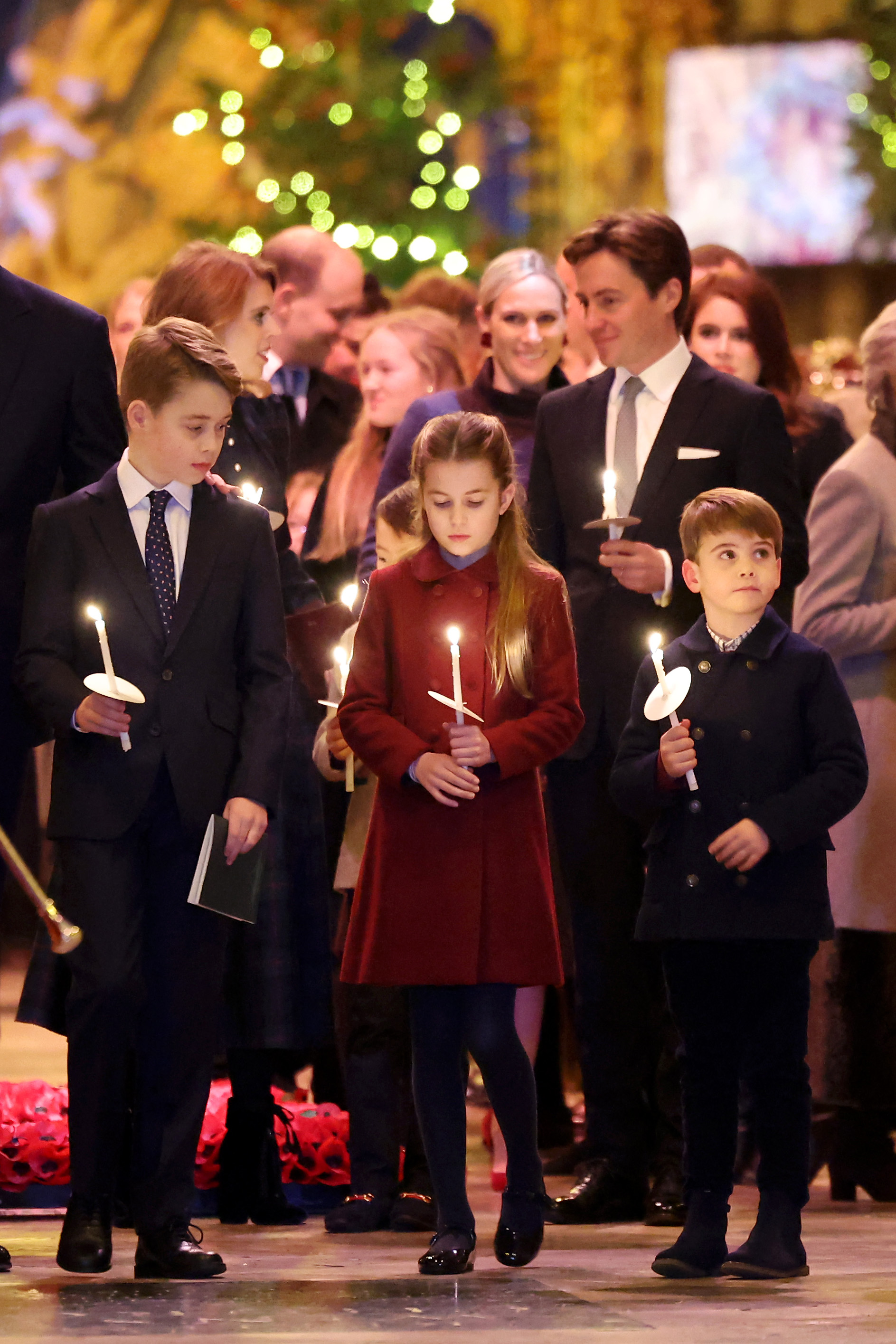 Prince George, Prince Louis and Princess Charlotte holding lit candles at Westminster Abbey