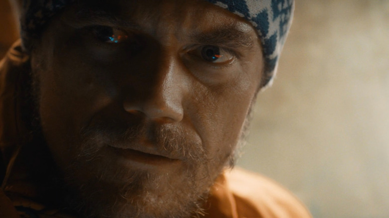 Mr. Green looking intensely at Isaac in The Night Before