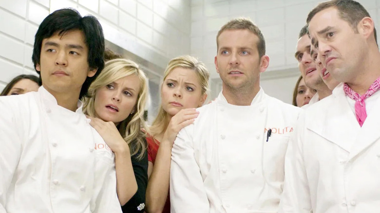 Jack Bourdain (Bradley Cooper) and the rest of his Nolita staff stand together in 