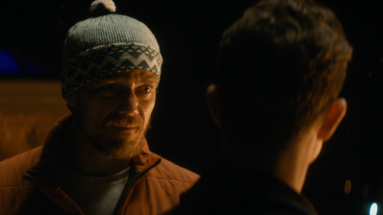 Mr. Green talking to Ethan on the roof in The Night Before