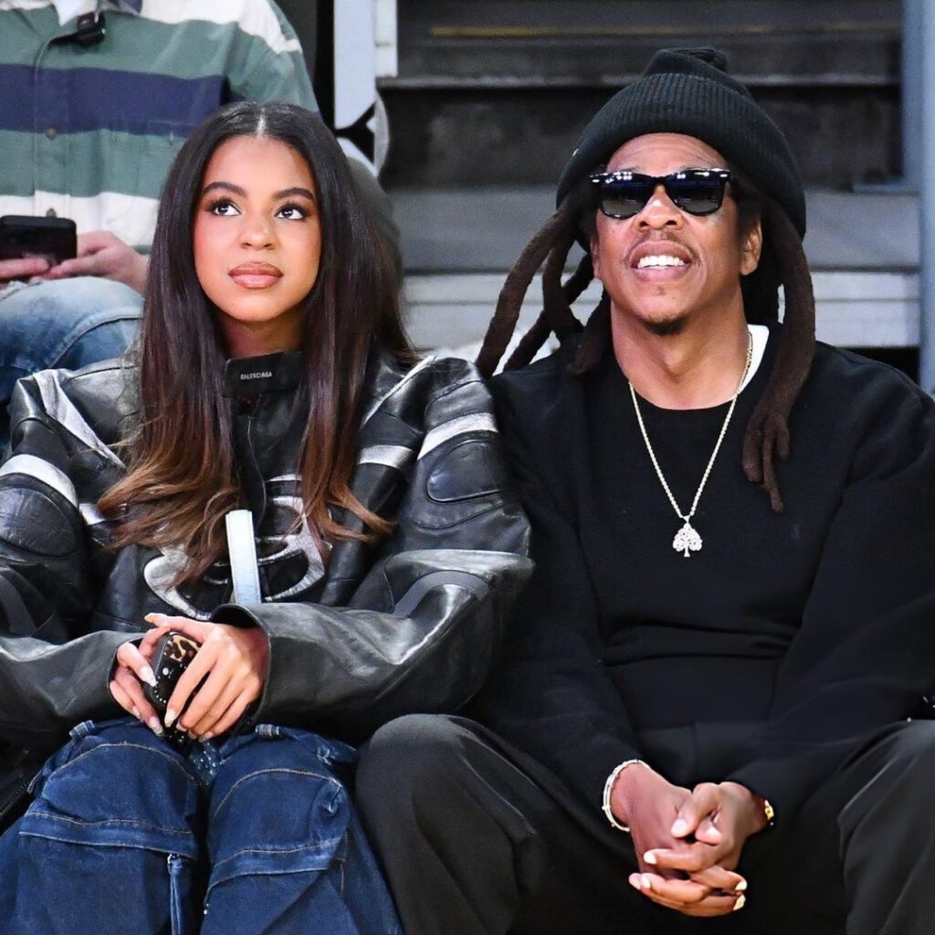 Blue Ivy Carter and Jay Z attending a Lakers game