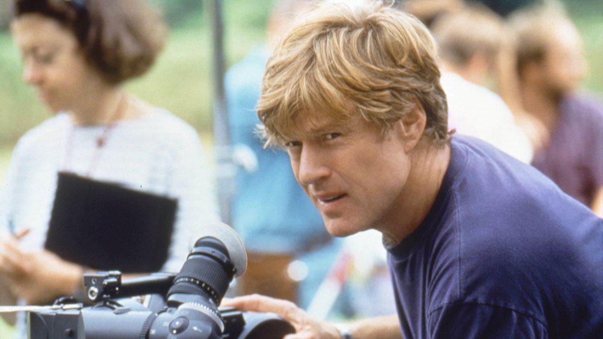 Robert Redford looking at the camera while filming.