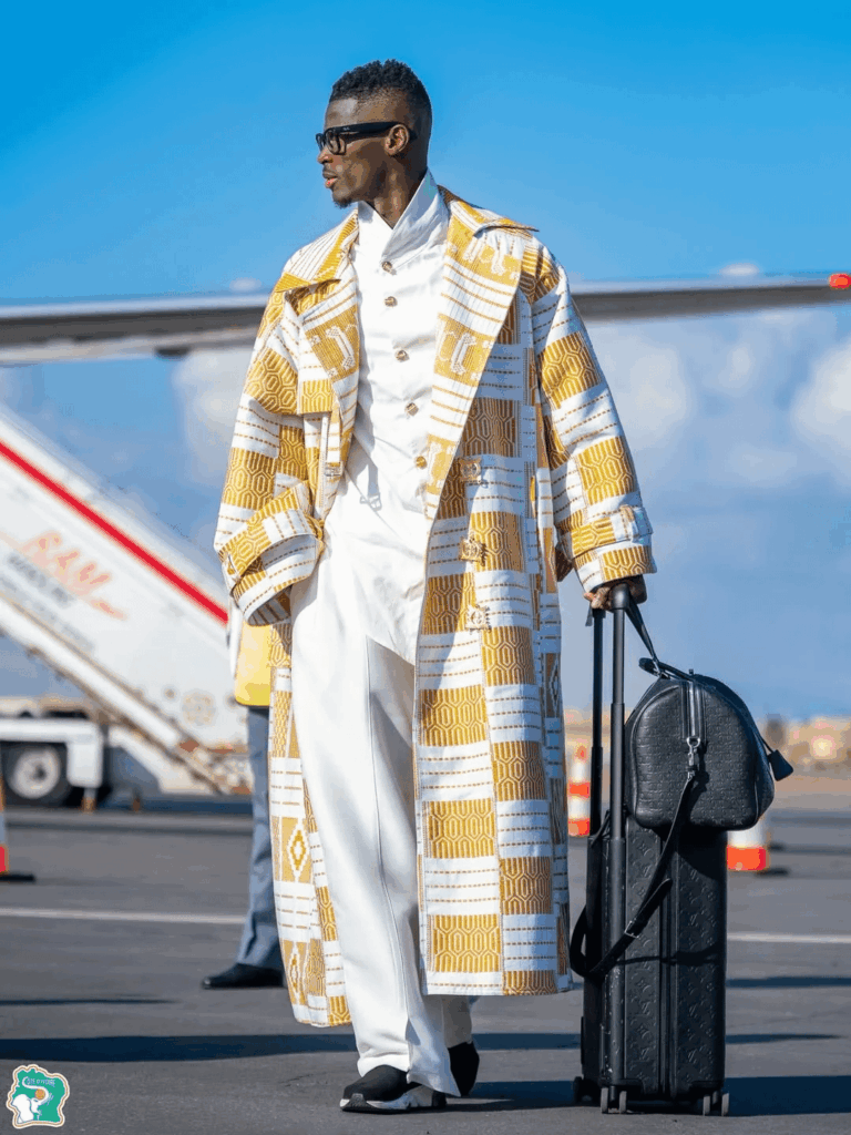 Côte d’Ivoire, arrived in style in Morocco for the 2025 AFCON tournament, wearing custom-made PUMA outfits, featuring a coat inspired by the traditional Kente cloth and Adinkra motifs in gold to represent that the team is the reigning champion. Côte d'Ivoire, arrived in style in Morocco for the 2025 AFCON tournament, wearing custom-made PUMA outfits, featuring a coat inspired by the traditional Kente cloth and Adinkra motifs in gold to represent that the team is the reigning champion.