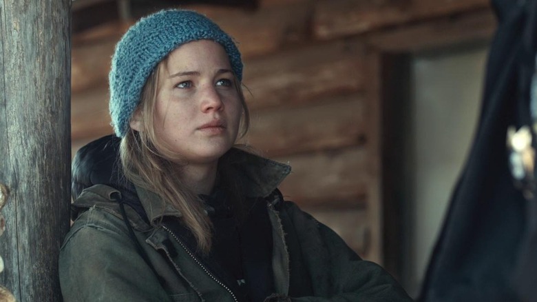 Jennifer Lawrence as Ree leaning against a post in Winter's Bone