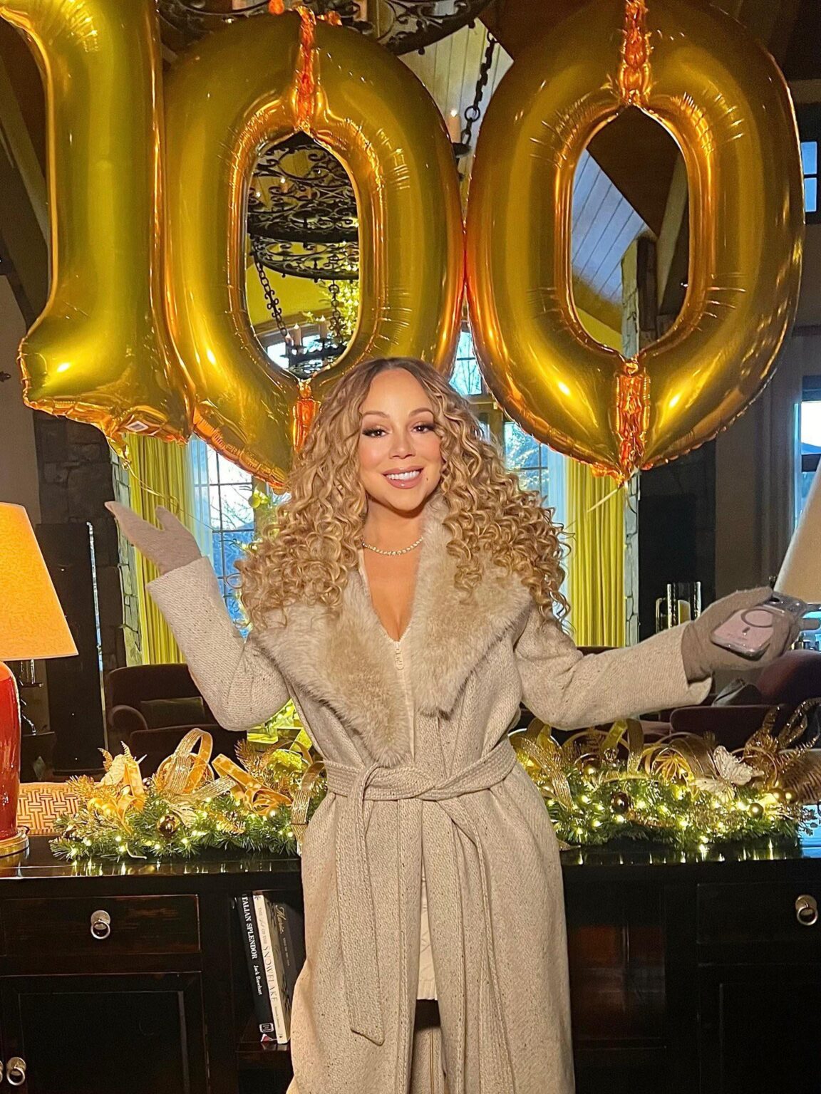 Mariah Carey celebrates her 100th week at #1 on the Billboard Hot 100