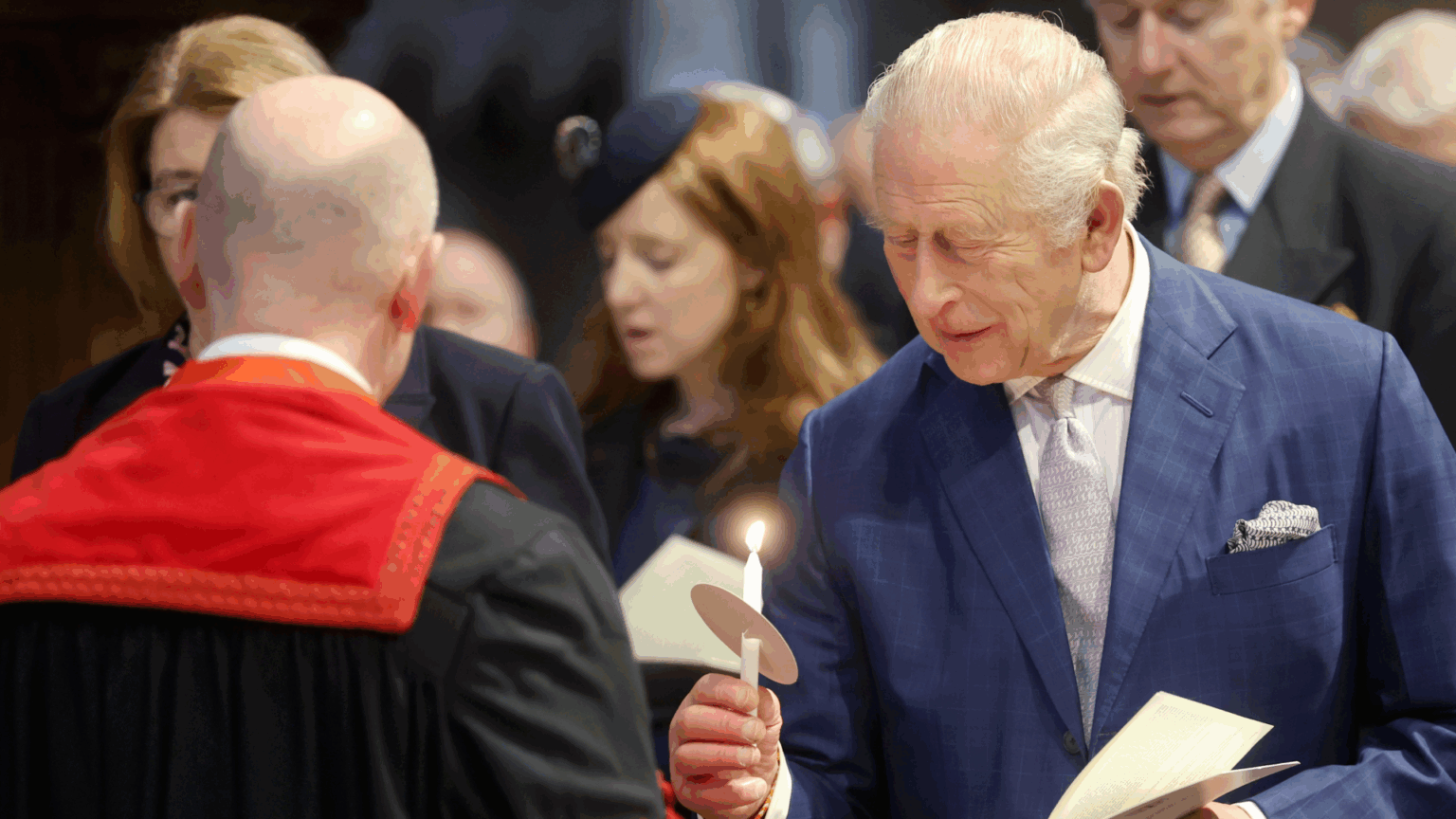 King Charles holding a candle