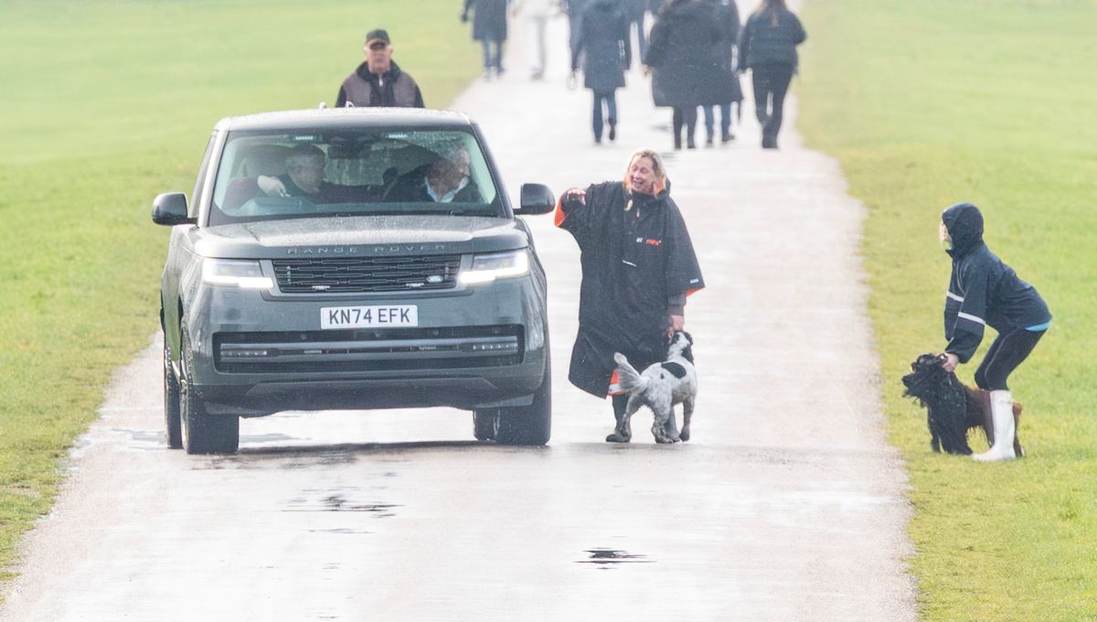 Andrew Mountbatten Windsor on his way down the Long Walk at Windsor as he got held up by two dog walkers and then had a cheery laugh and joke with them