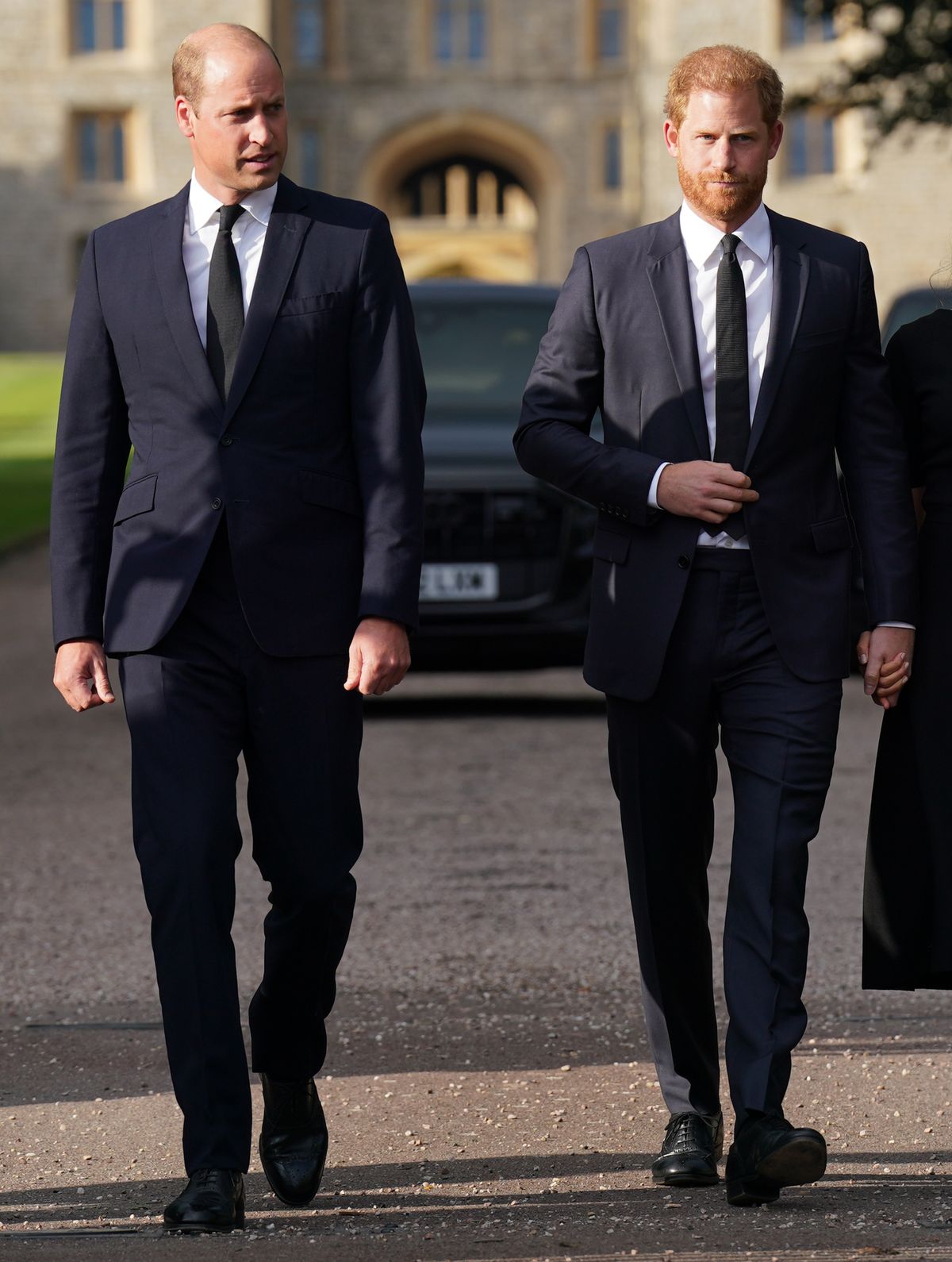Prince William, Prince of Wales and Prince Harry, Duke of Sussex walk together to meet members of the public on the long Walk at Windsor Castle on September 10, 2022 in Windsor, England. Crowds have gathered and tributes left at the gates of Windsor Castle to Queen Elizabeth II, who died at Balmoral Castle on 8 September, 2022