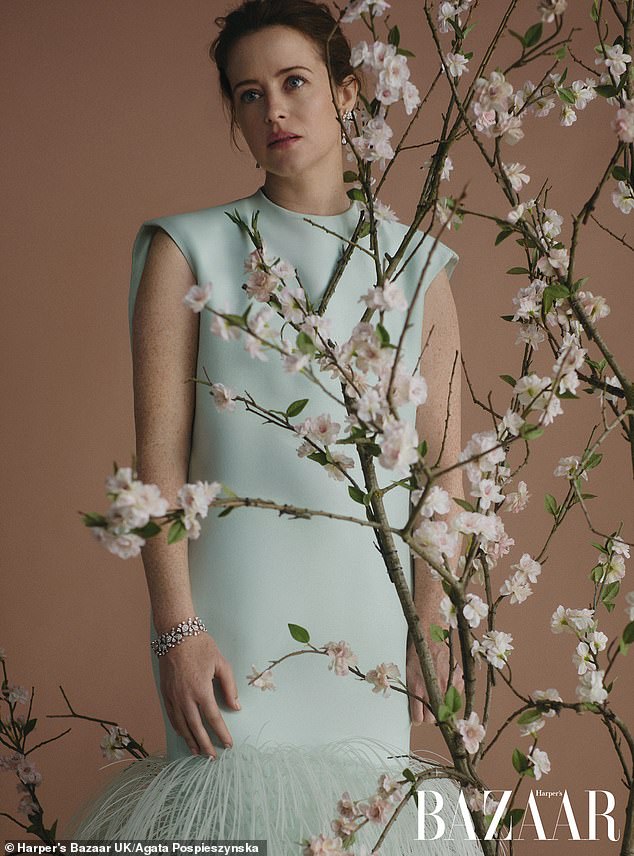 Claire wowed in the classy shoot as she wore a pastel blue dress with feathered edging for one shot