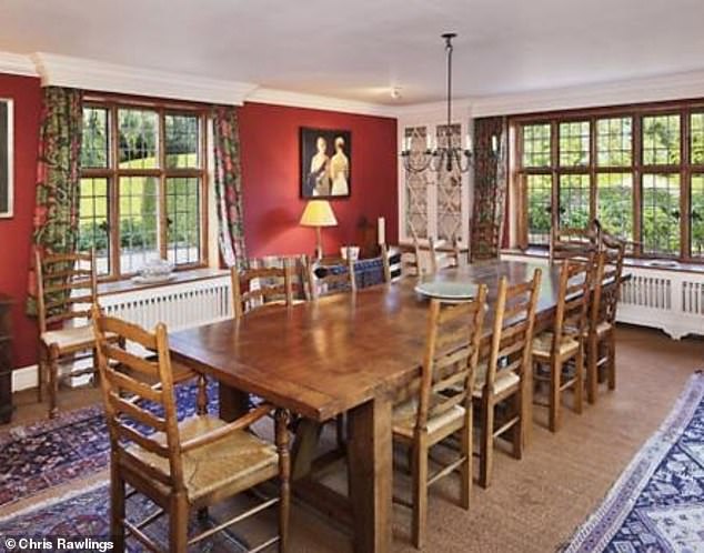 It comes after extra security measures including 6ft high oak gates were installed at the rambling Grade II–listed 15th Century property (Pictured: The dining room in the home)