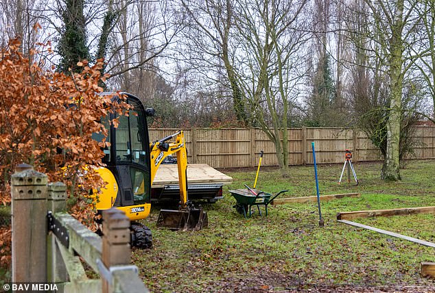 A solid six-foot high wooden fence has sprung up around parts of the perimeter