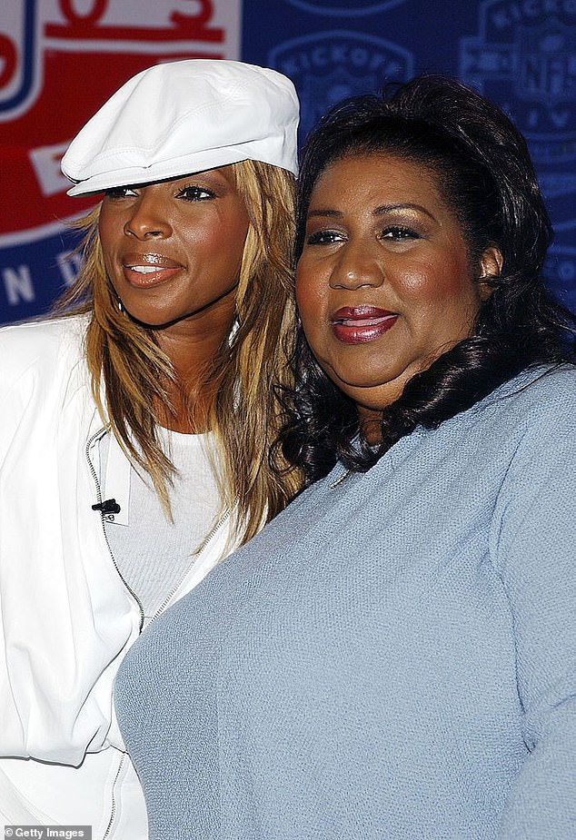 Blige is pictured with the late Queen of Soul at an event in 2003