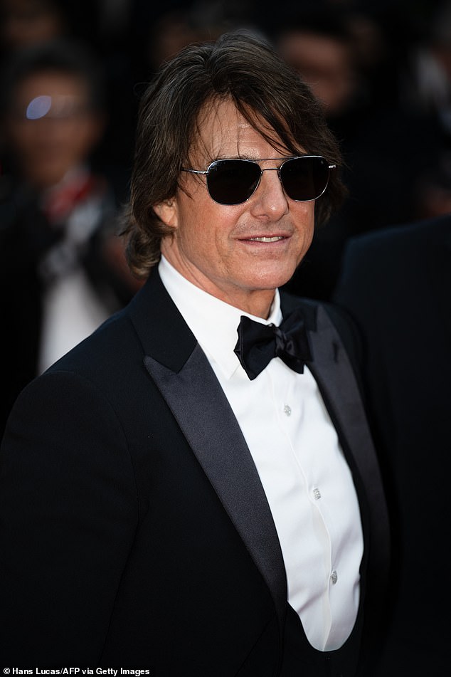 The Welsh singer, 45, recalled the embarrassing moment the actor, was 'body-slammed against a wall' by military personnel backstage (Tom pictured in May)